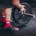 person arranging barbell plate